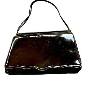 Mid Century 1960s patent leather shoulder bag. Stunning brass accents. Retro Gem